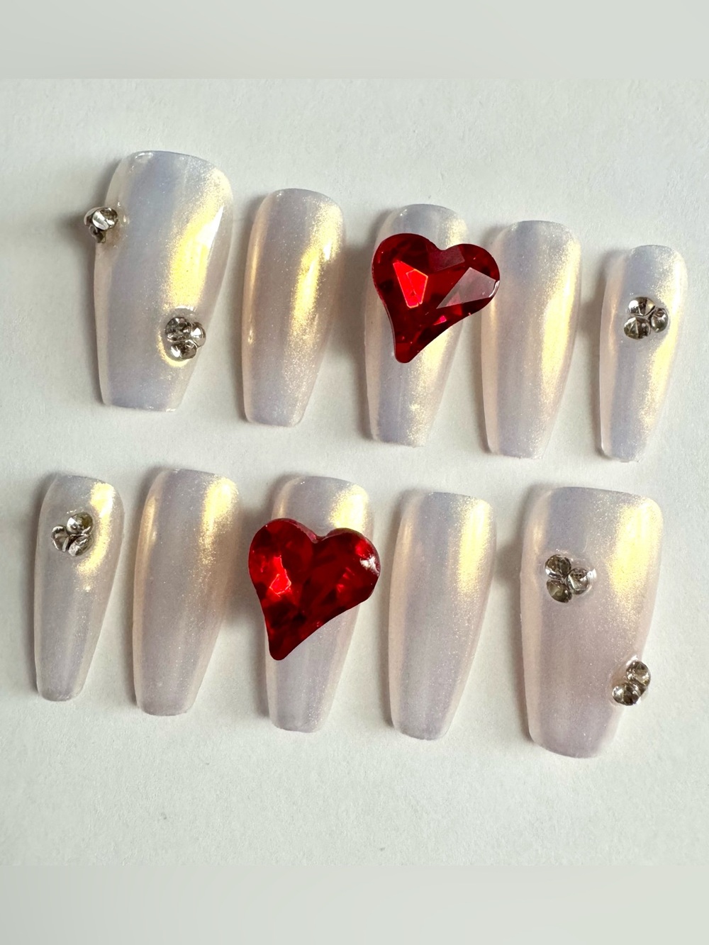 Iridescent Pearl Press-On Nails with Red Heart Gems